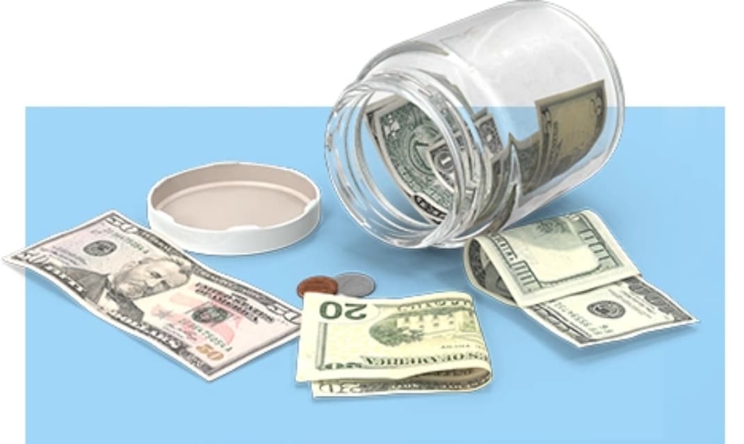 Find a Personal Loan Jar of dollars and coins tipped over on a table